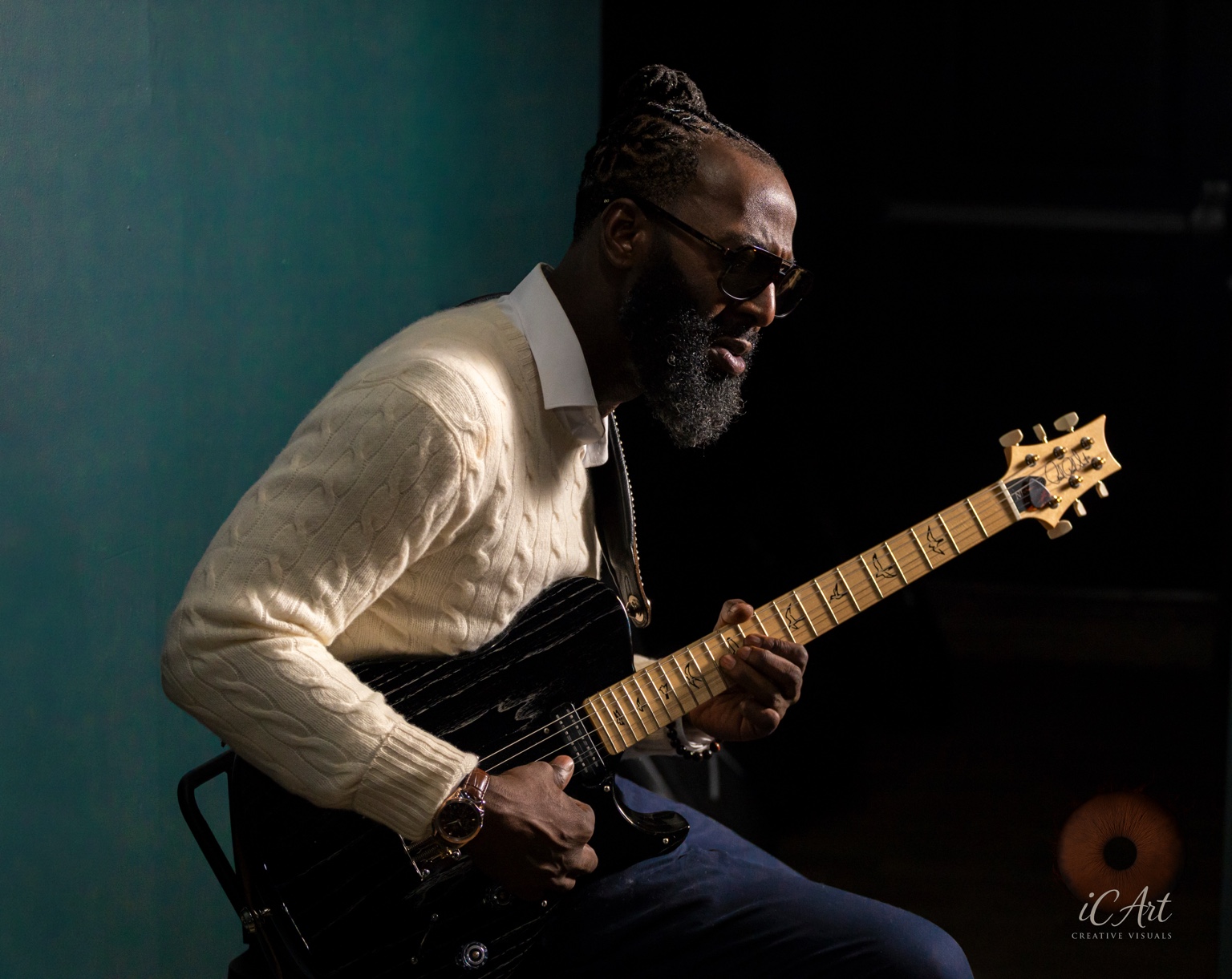 Kenny Rocket playing his guitar